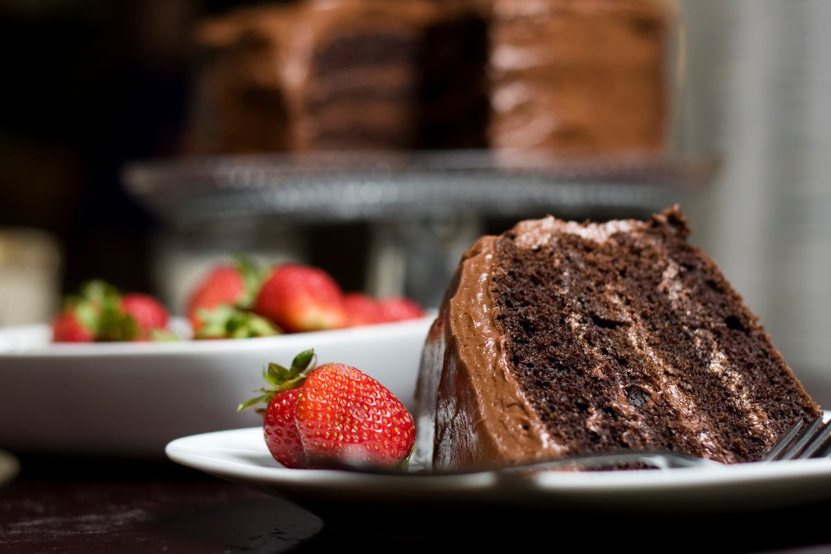 Close-up of a layered cake with various types of cake fillings, including buttercream, custard, and fruit fillings.