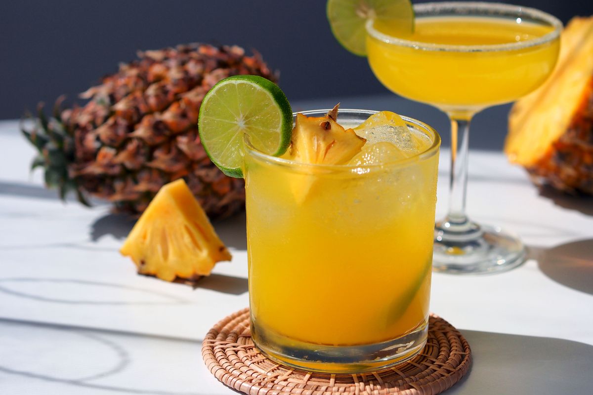 Tropical Pineapple Rum Drink in a glass with garnish